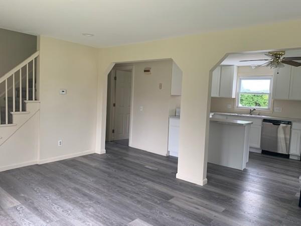 53 Moss Road Springfield, MA 01119 - Photo 5 of 15 an empty room with wooden floor and a window