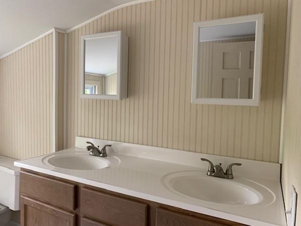 53 Moss Road Springfield, MA 01119 - Photo 8 of 15 a bathroom with a sink and a mirror