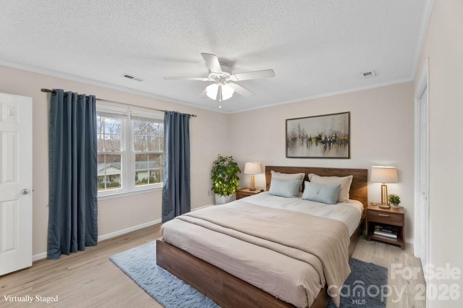 a bedroom with a large bed and a window