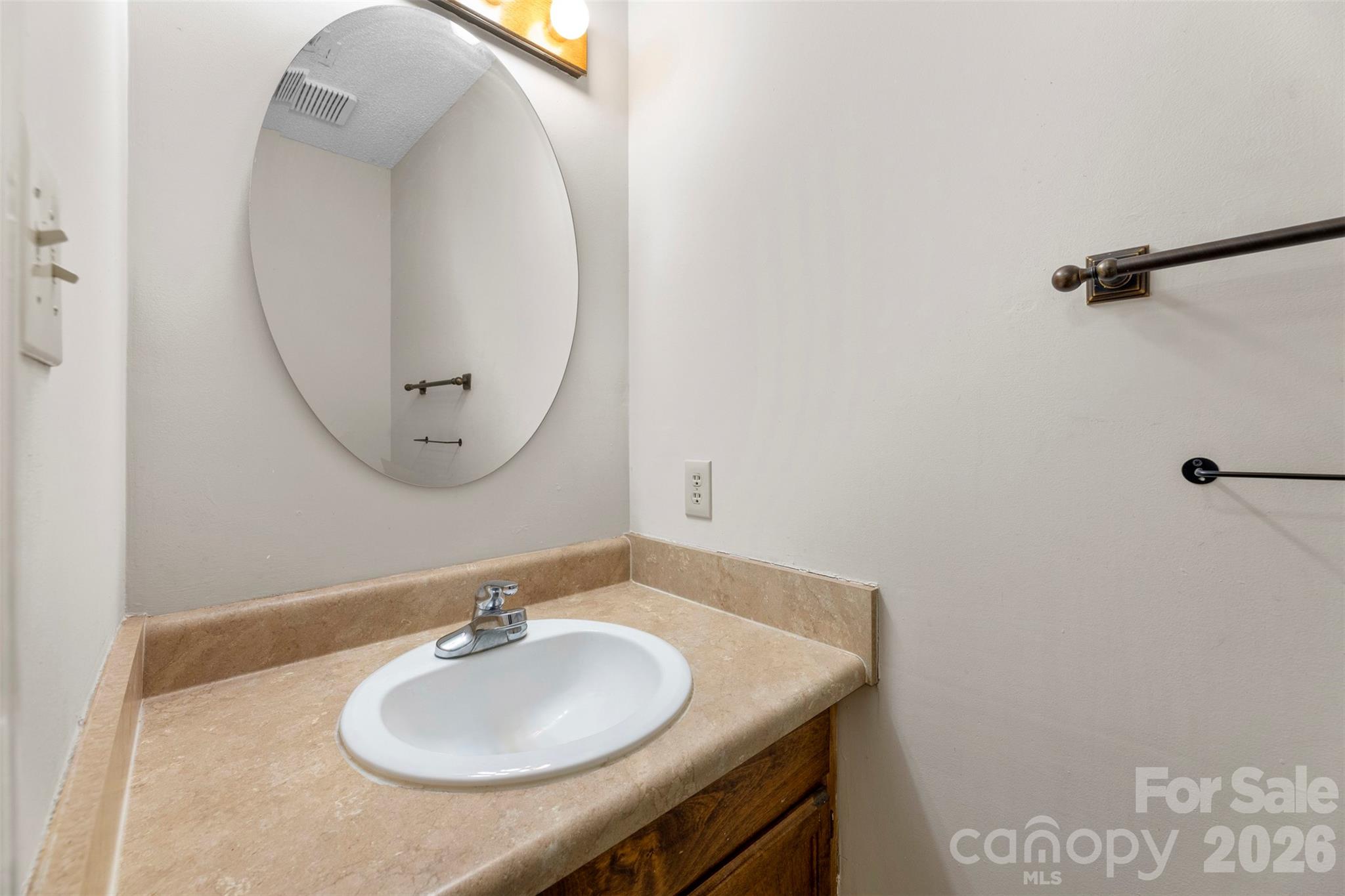 618 Tryon Place Gastonia, NC 28054 - Photo 12 of 32 a bathroom with a sink and a mirror