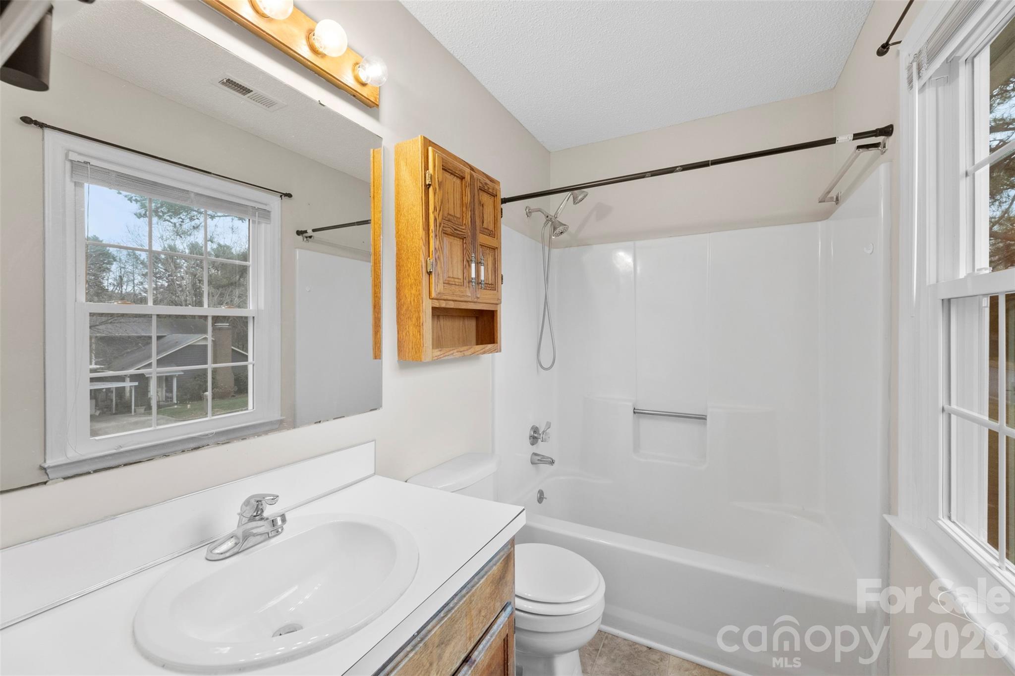 618 Tryon Place Gastonia, NC 28054 - Photo 14 of 32 a bathroom with a sink toilet and shower
