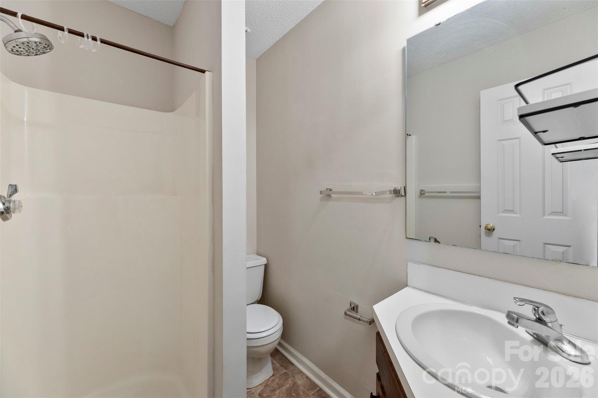618 Tryon Place Gastonia, NC 28054 - Photo 15 of 32 a bathroom with a sink a toilet and shower