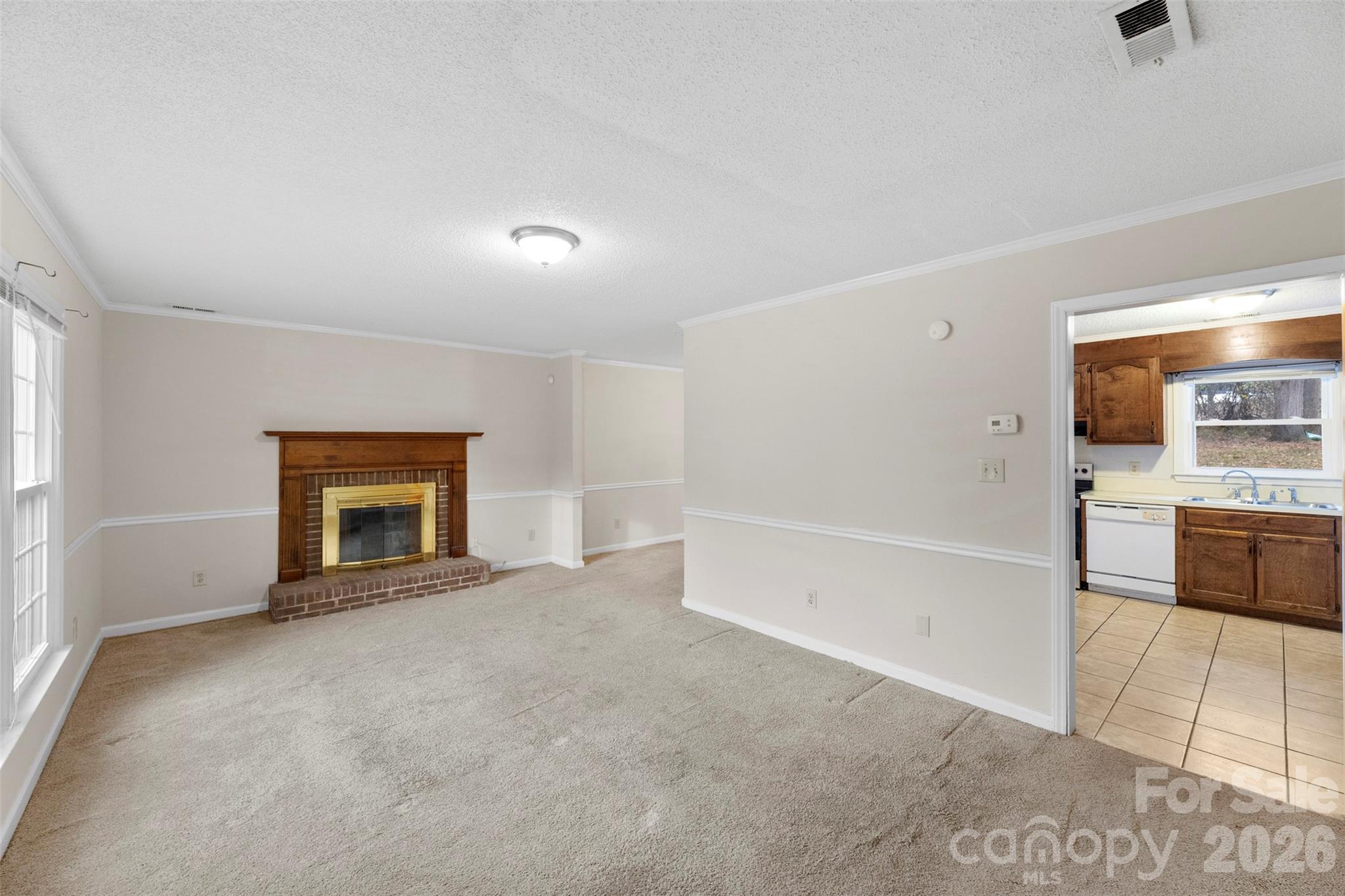 618 Tryon Place Gastonia, NC 28054 - Photo 22 of 32 an empty room with fireplace and windows