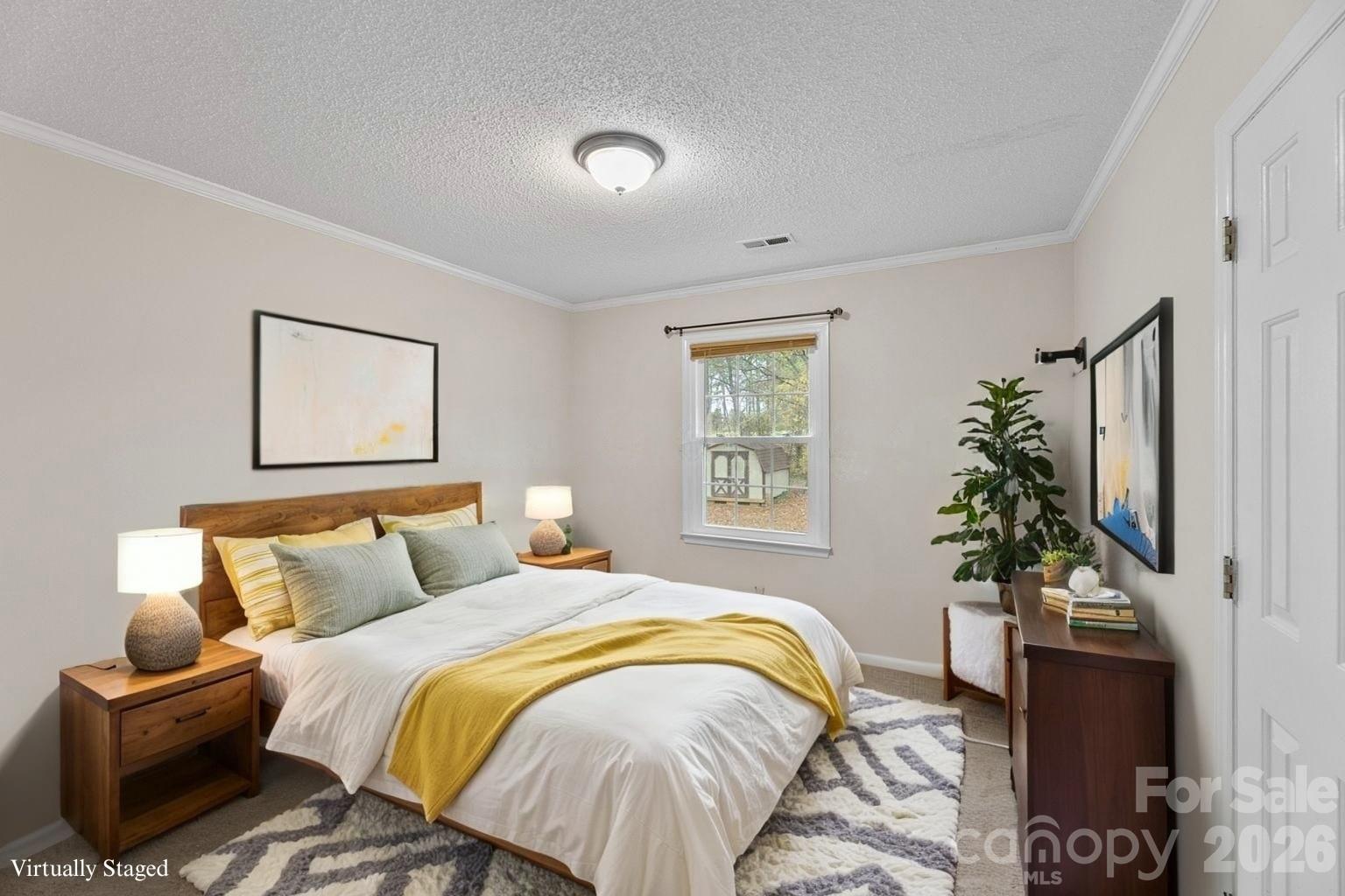 618 Tryon Place Gastonia, NC 28054 - Photo 3 of 32 a bedroom with a bed and a potted plant