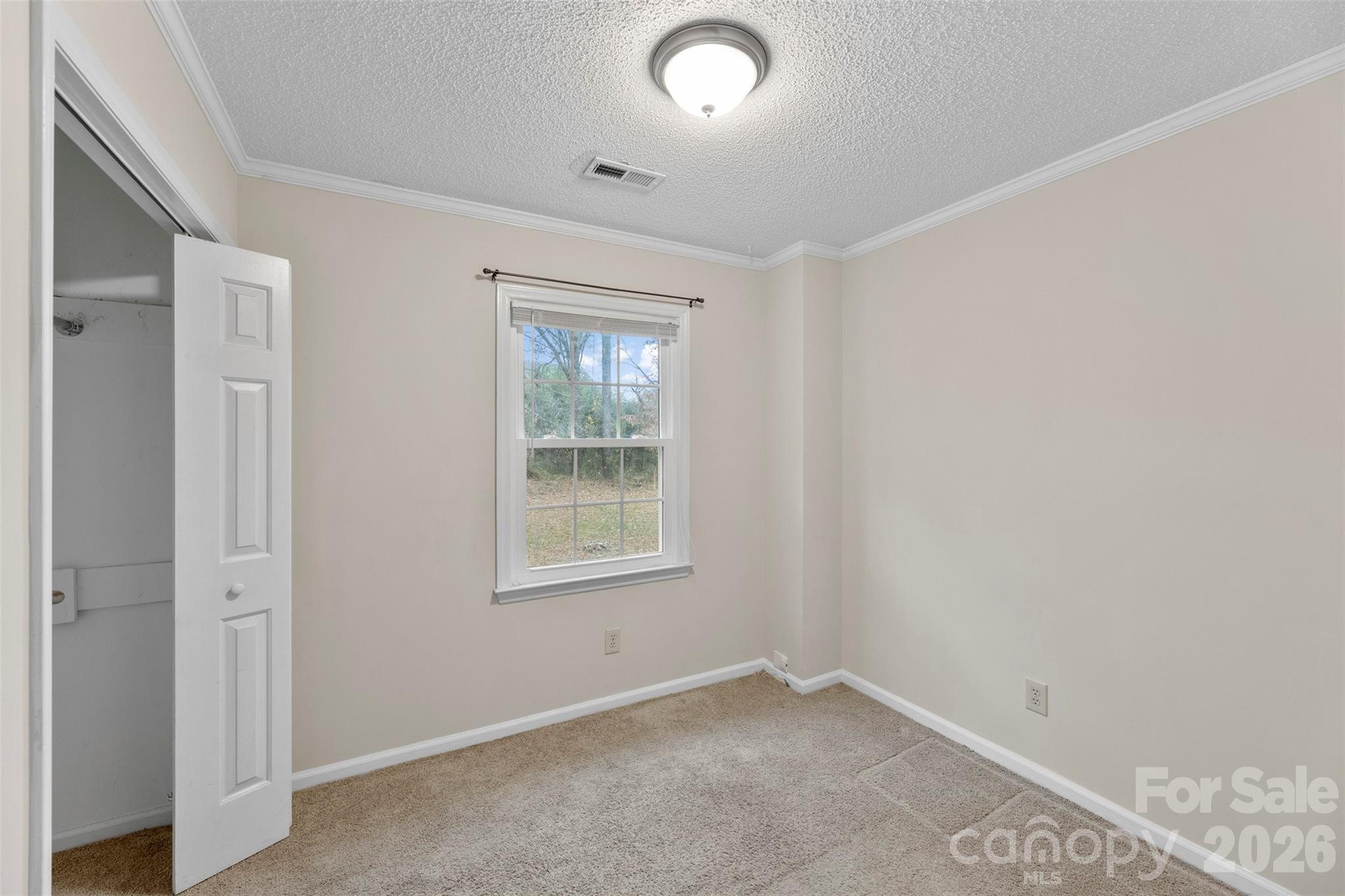 618 Tryon Place Gastonia, NC 28054 - Photo 31 of 32 an empty room with windows