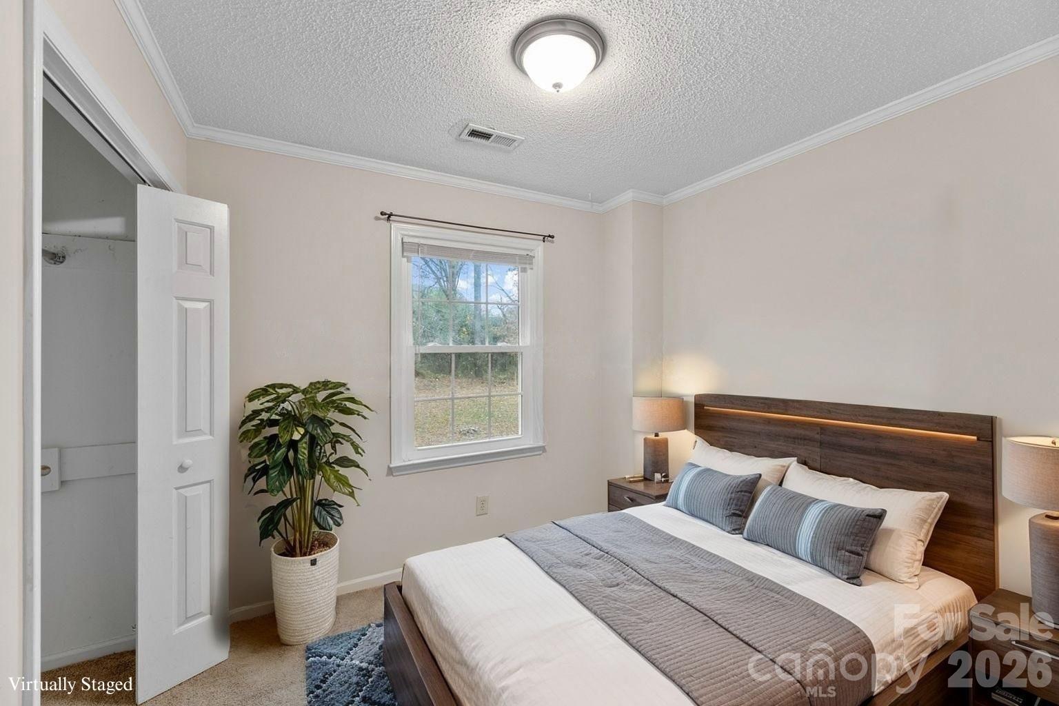 618 Tryon Place Gastonia, NC 28054 - Photo 4 of 32 a bedroom with a bed and a window