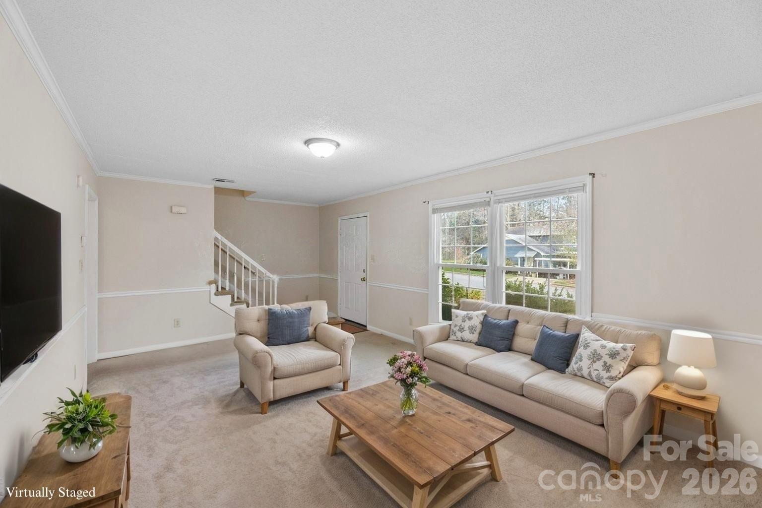 618 Tryon Place Gastonia, NC 28054 - Photo 6 of 32 a living room with furniture and a flat screen tv