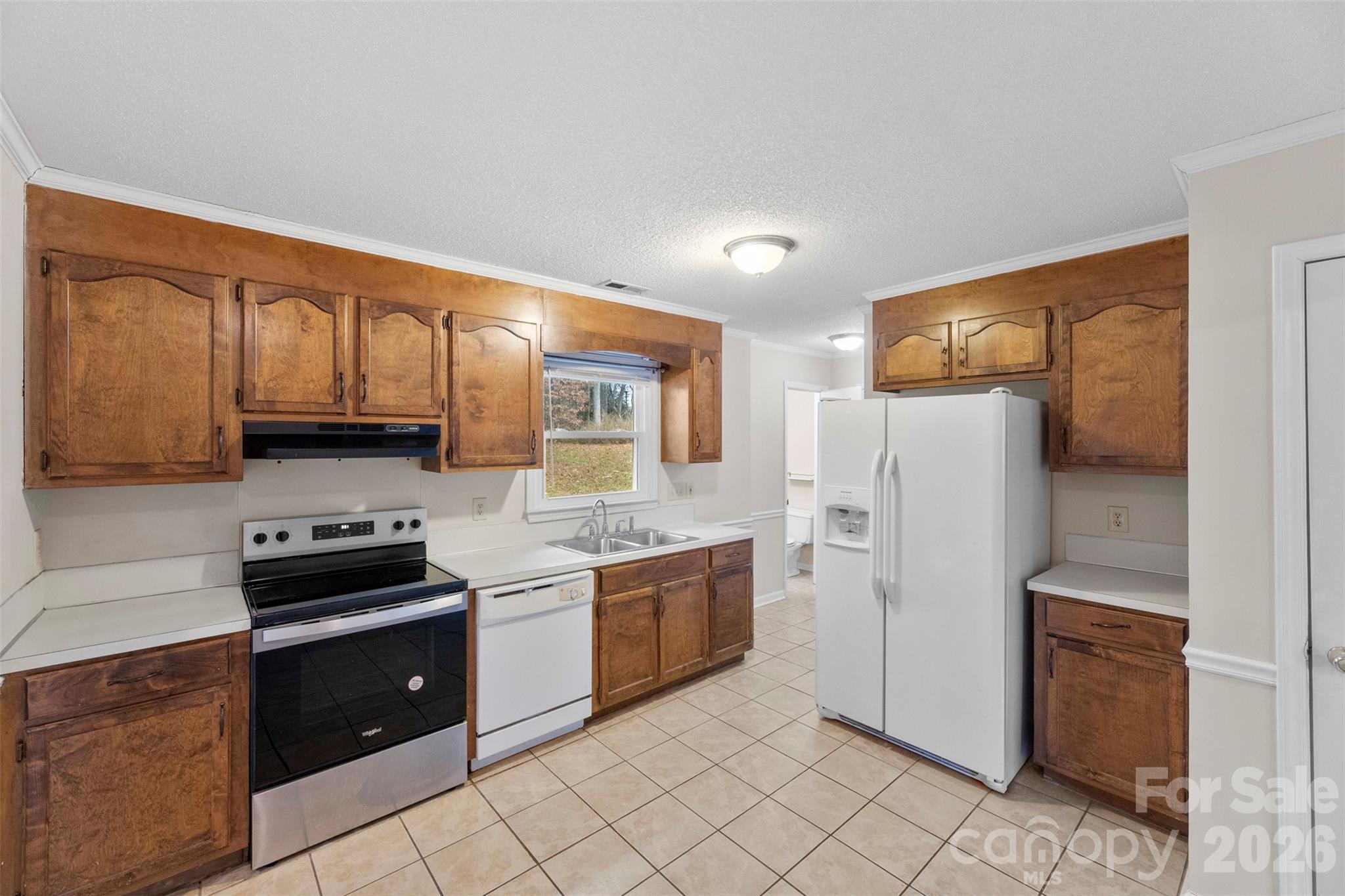 618 Tryon Place Gastonia, NC 28054 - Photo 10 of 32 a kitchen with stainless steel appliances granite countertop a refrigerator and a stove top oven
