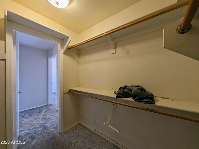 an empty room with a view of a bathroom