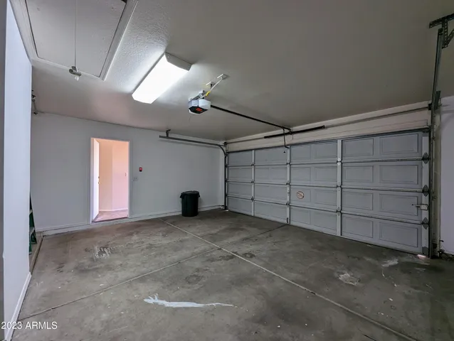 a view of a two chairs in the patio