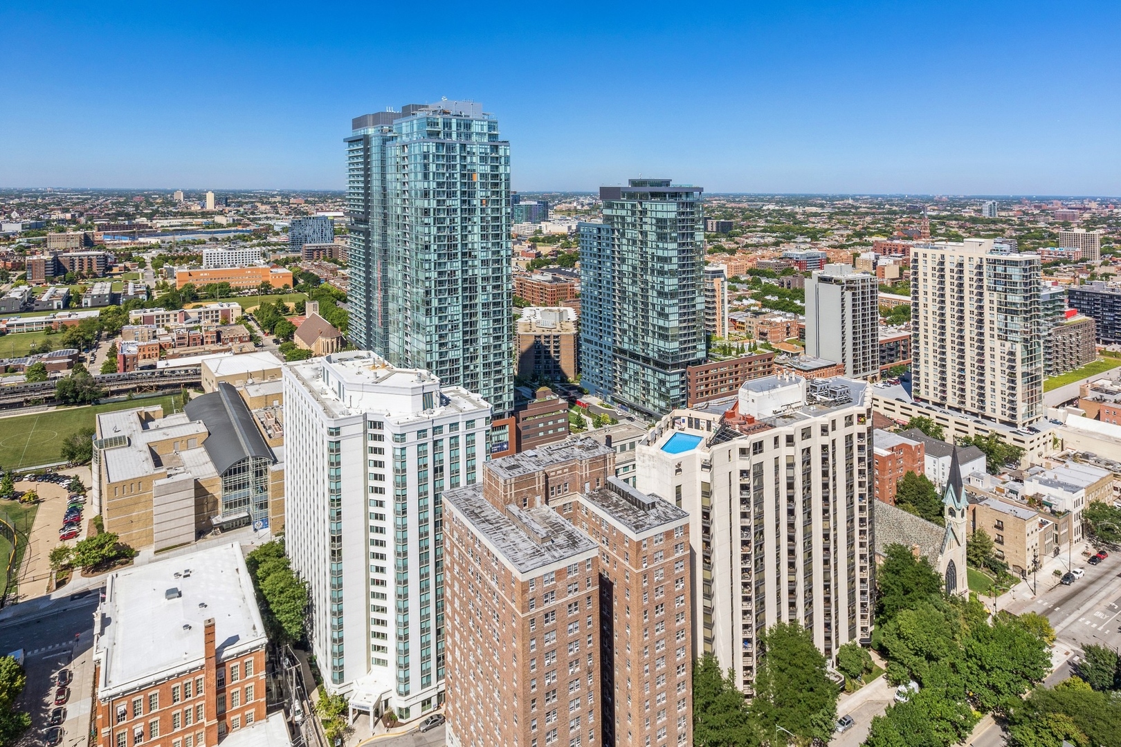 111 West Maple Street, Unit 3311 Chicago, IL 60610 - Photo 11 of 15 a view of a city with tall buildings