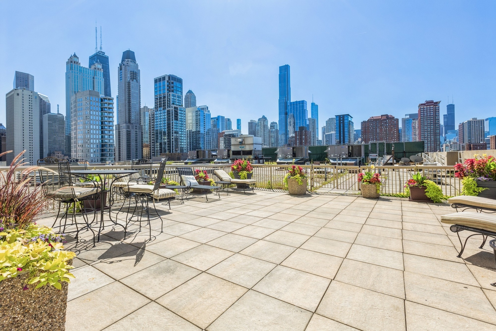 111 West Maple Street, Unit 3311 Chicago, IL 60610 - Photo 14 of 15 a view of roof with lawn chairs and bench
