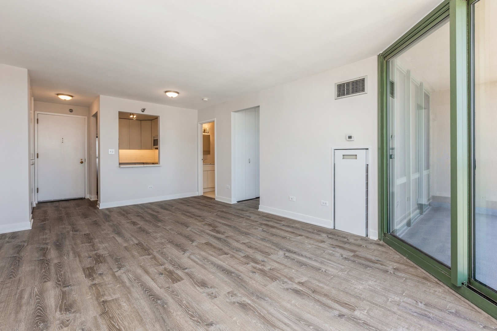 111 West Maple Street, Unit 3311 Chicago, IL 60610 - Photo 4 of 15 a view of empty room with wooden floor
