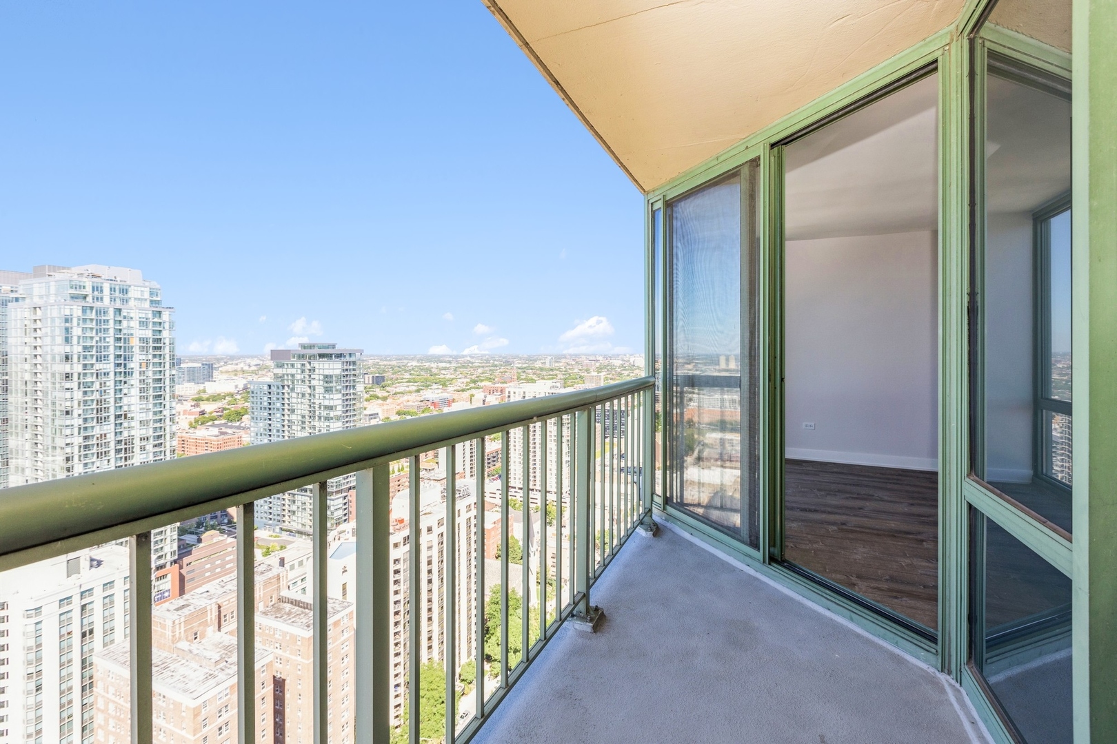 111 West Maple Street, Unit 3311 Chicago, IL 60610 - Photo 10 of 15 a view of city from a balcony