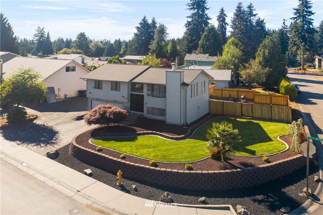 2603 171st Street Southeast Bothell, WA 98012 - Photo 1 of 37 a view of a swimming pool with a back yard