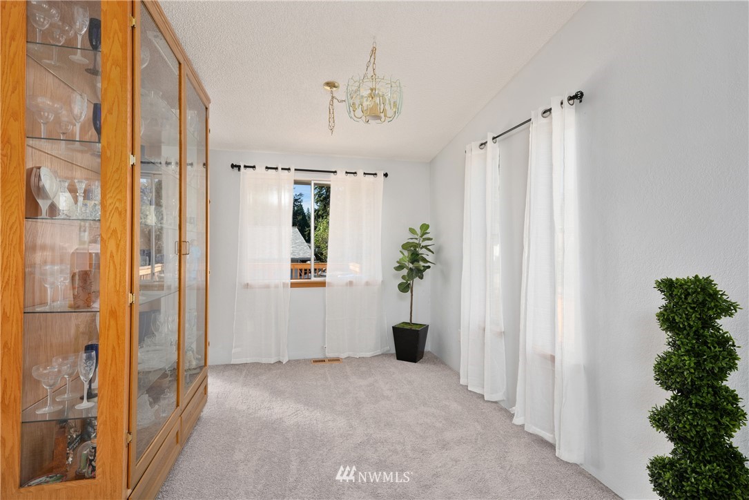 2603 171st Street Southeast Bothell, WA 98012 - Photo 12 of 37 a view of an entryway with wooden floor and a livingroom