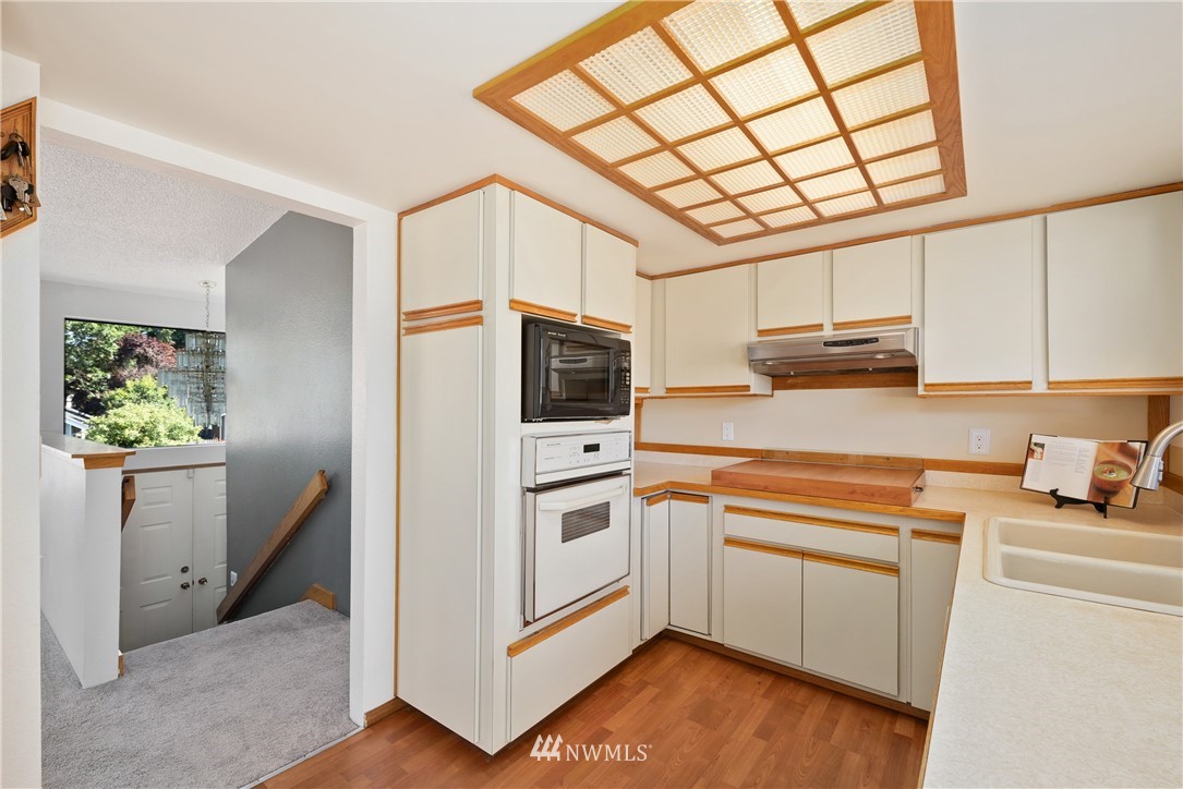 2603 171st Street Southeast Bothell, WA 98012 - Photo 14 of 37 a kitchen with stainless steel appliances a stove a sink and a microwave