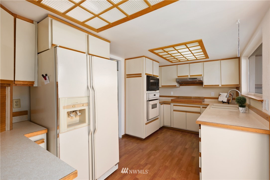 2603 171st Street Southeast Bothell, WA 98012 - Photo 17 of 37 a kitchen with a refrigerator and a sink