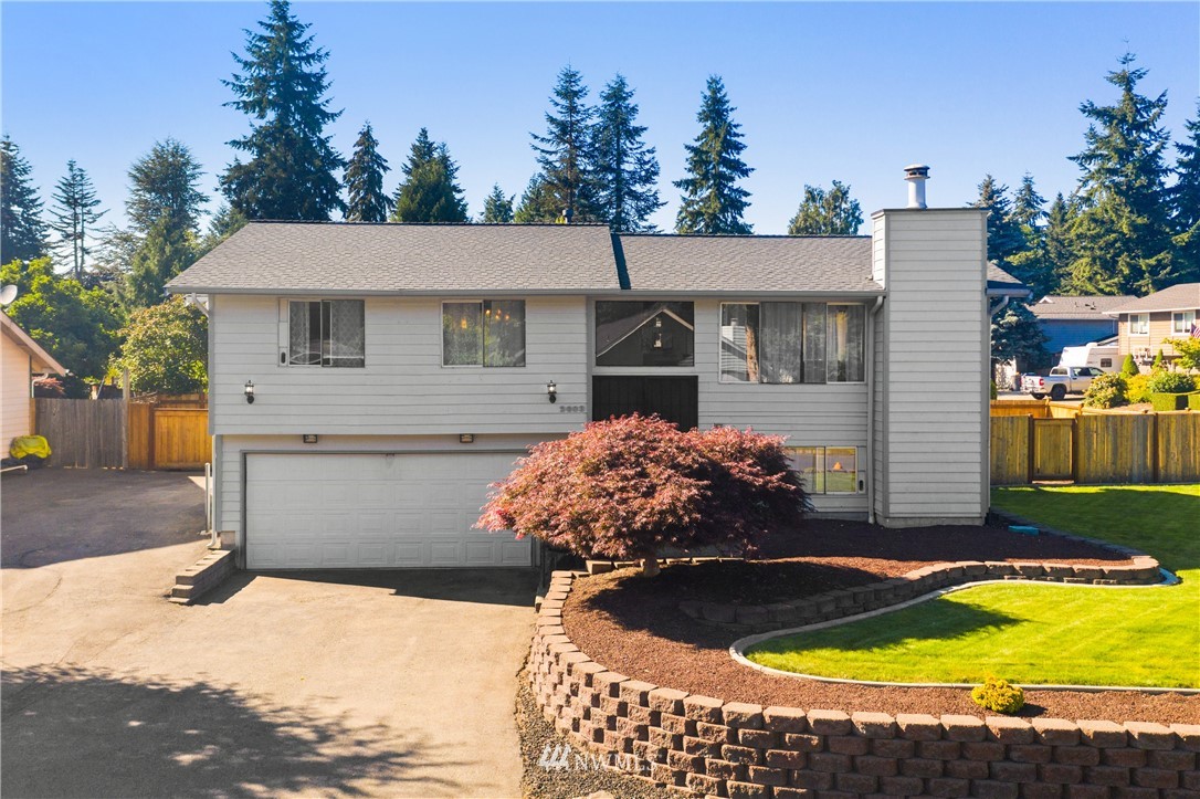 2603 171st Street Southeast Bothell, WA 98012 - Photo 3 of 37 a view of a house with swimming pool and sitting area