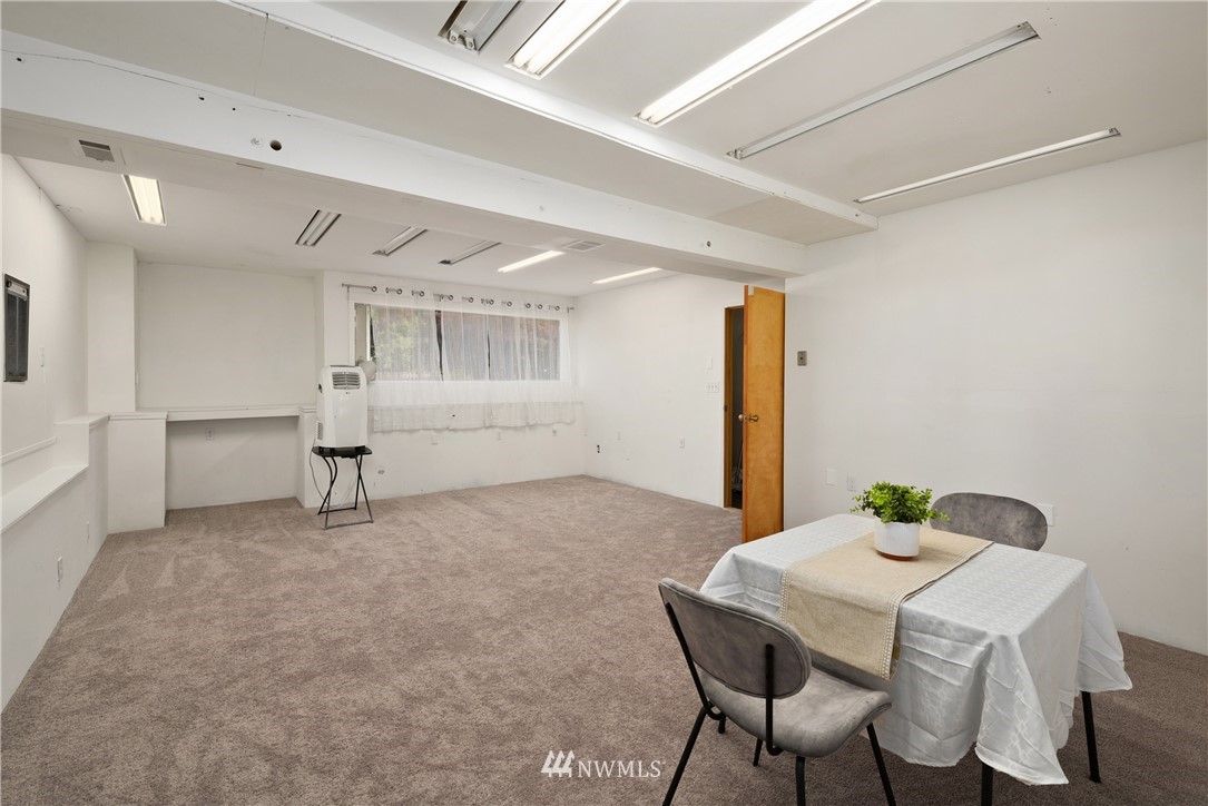 2603 171st Street Southeast Bothell, WA 98012 - Photo 26 of 37 a view of a dining room with furniture and wooden floor