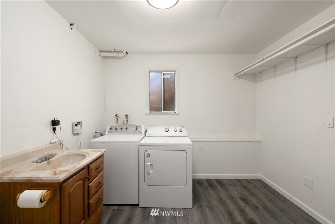2603 171st Street Southeast Bothell, WA 98012 - Photo 28 of 37 a utility room with cabinets washer and dryer