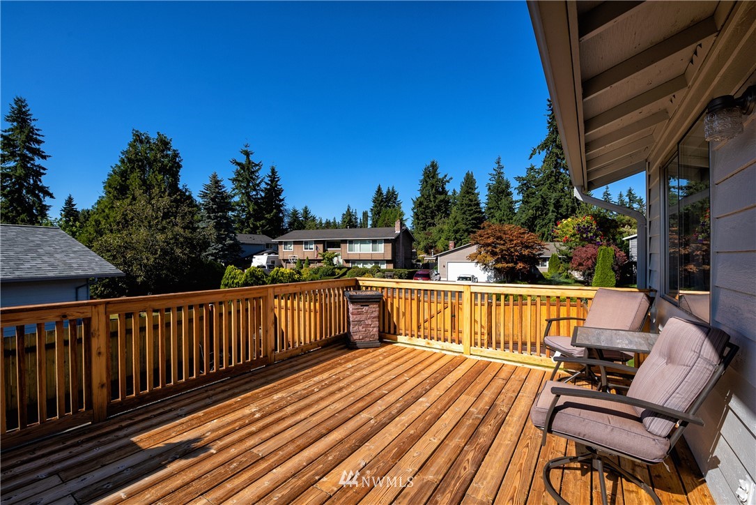 2603 171st Street Southeast Bothell, WA 98012 - Photo 30 of 37 a view of balcony with wooden floor and outdoor seating
