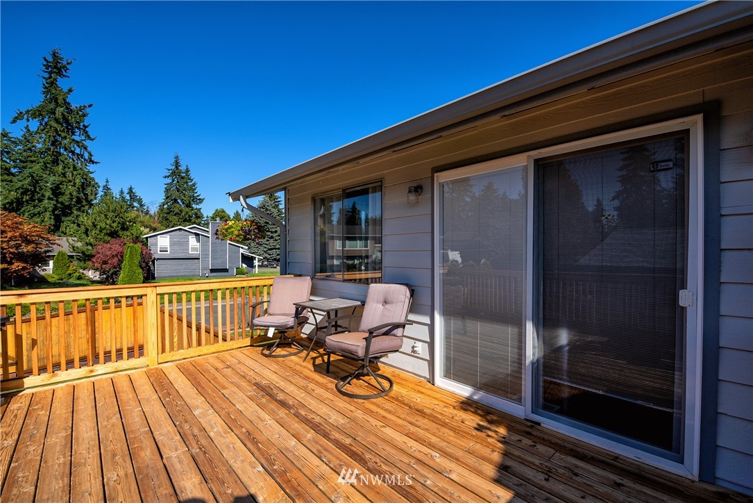 2603 171st Street Southeast Bothell, WA 98012 - Photo 31 of 37 a view of a balcony with chair and wooden floor
