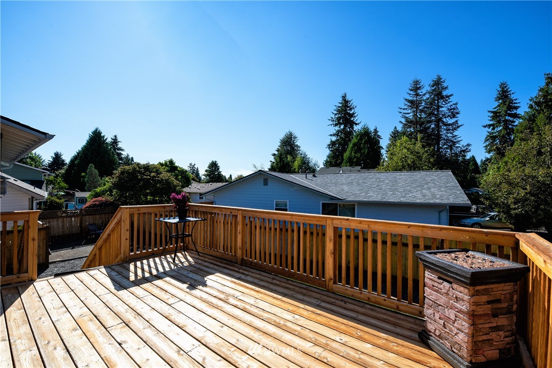 2603 171st Street Southeast Bothell, WA 98012 - Photo 32 of 37 a view of balcony with wooden floor and outdoor seating