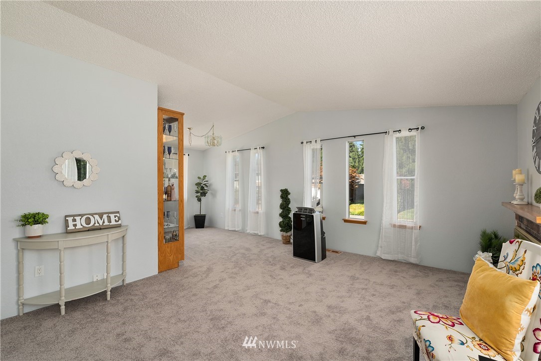 2603 171st Street Southeast Bothell, WA 98012 - Photo 7 of 37 a view of a livingroom with furniture and windows