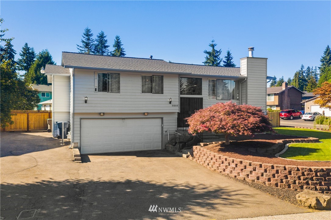 2603 171st Street Southeast Bothell, WA 98012 - Photo 10 of 37 a front view of a house with a yard
