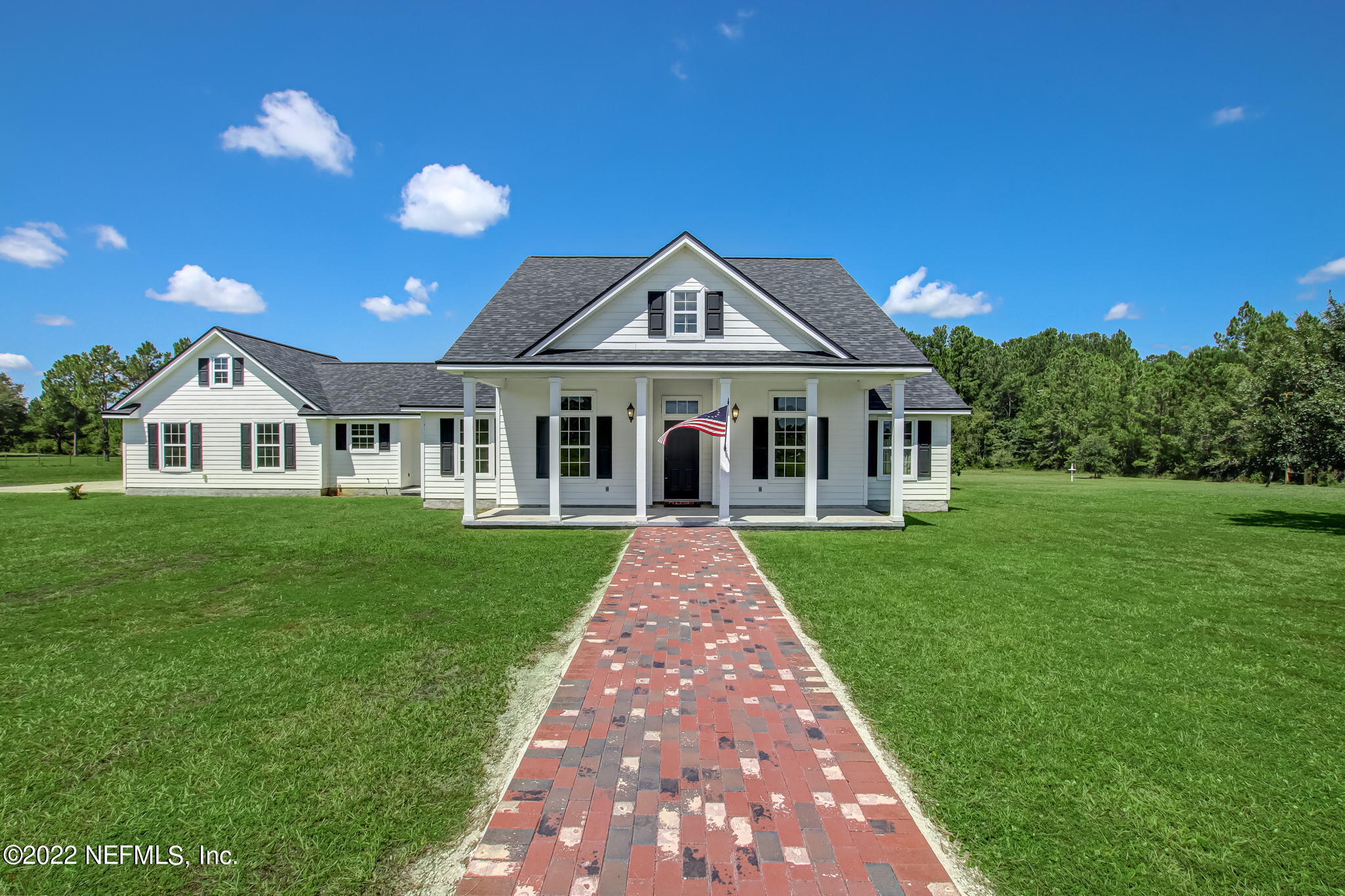 a front view of a house with yard