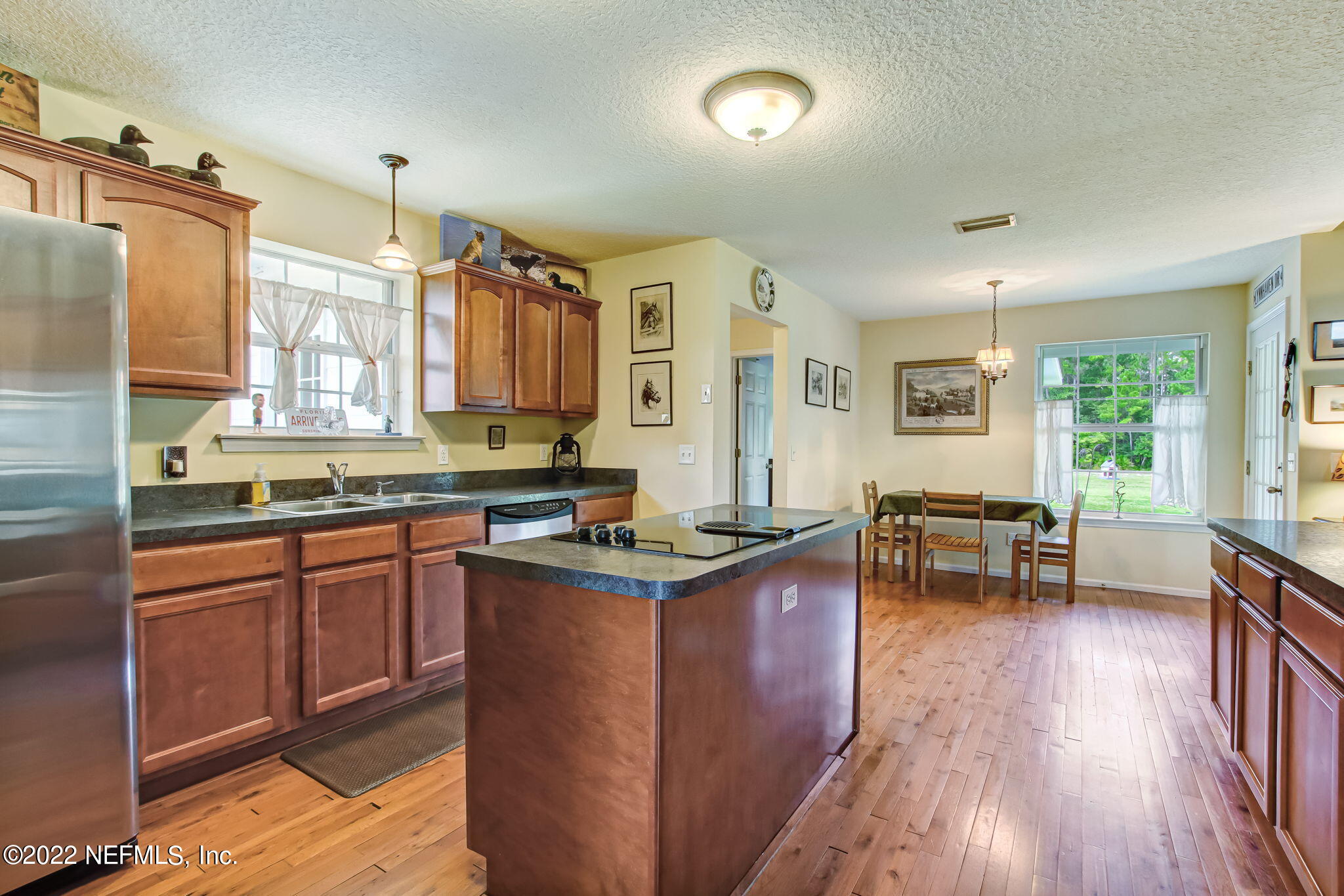 12410 County Road 121 Bryceville, FL 32009 - Photo 12 of 34 a kitchen with stainless steel appliances granite countertop a stove and a refrigerator