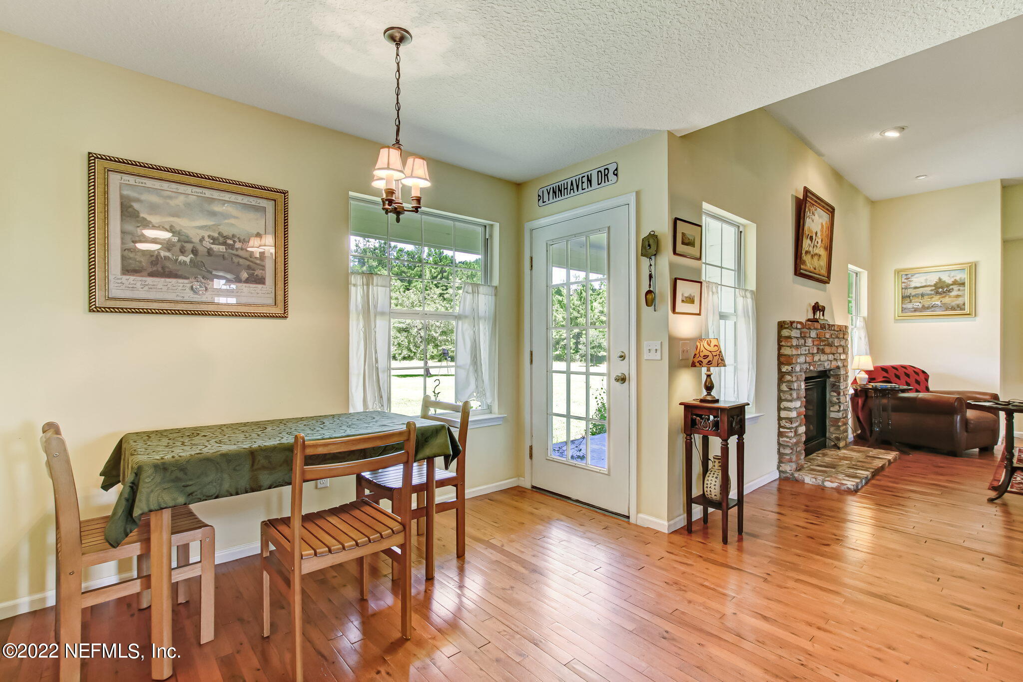 12410 County Road 121 Bryceville, FL 32009 - Photo 14 of 34 a view of a dining room with furniture window and wooden floor