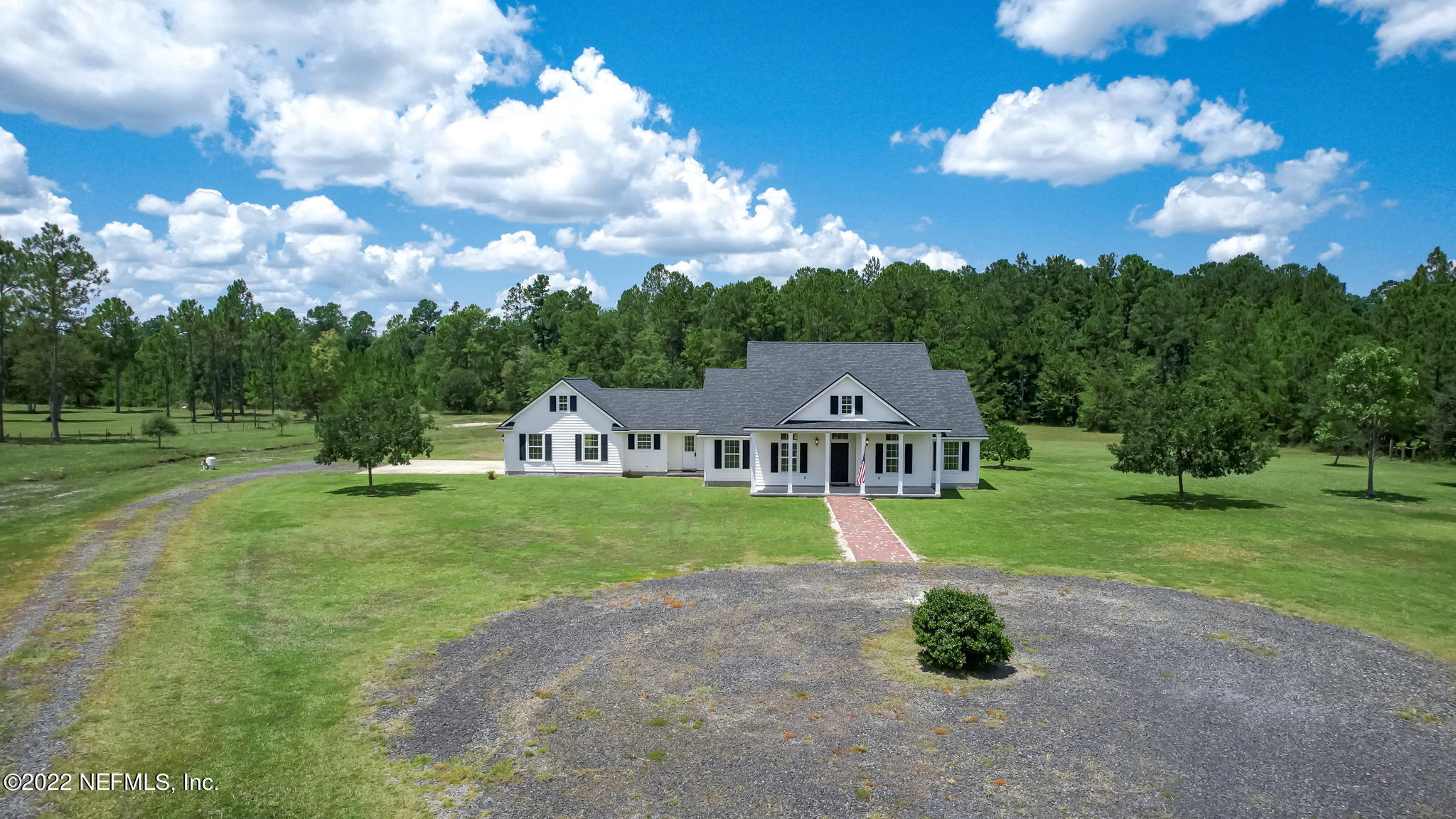 12410 County Road 121 Bryceville, FL 32009 - Photo 26 of 34 a front view of a house with a yard and trees