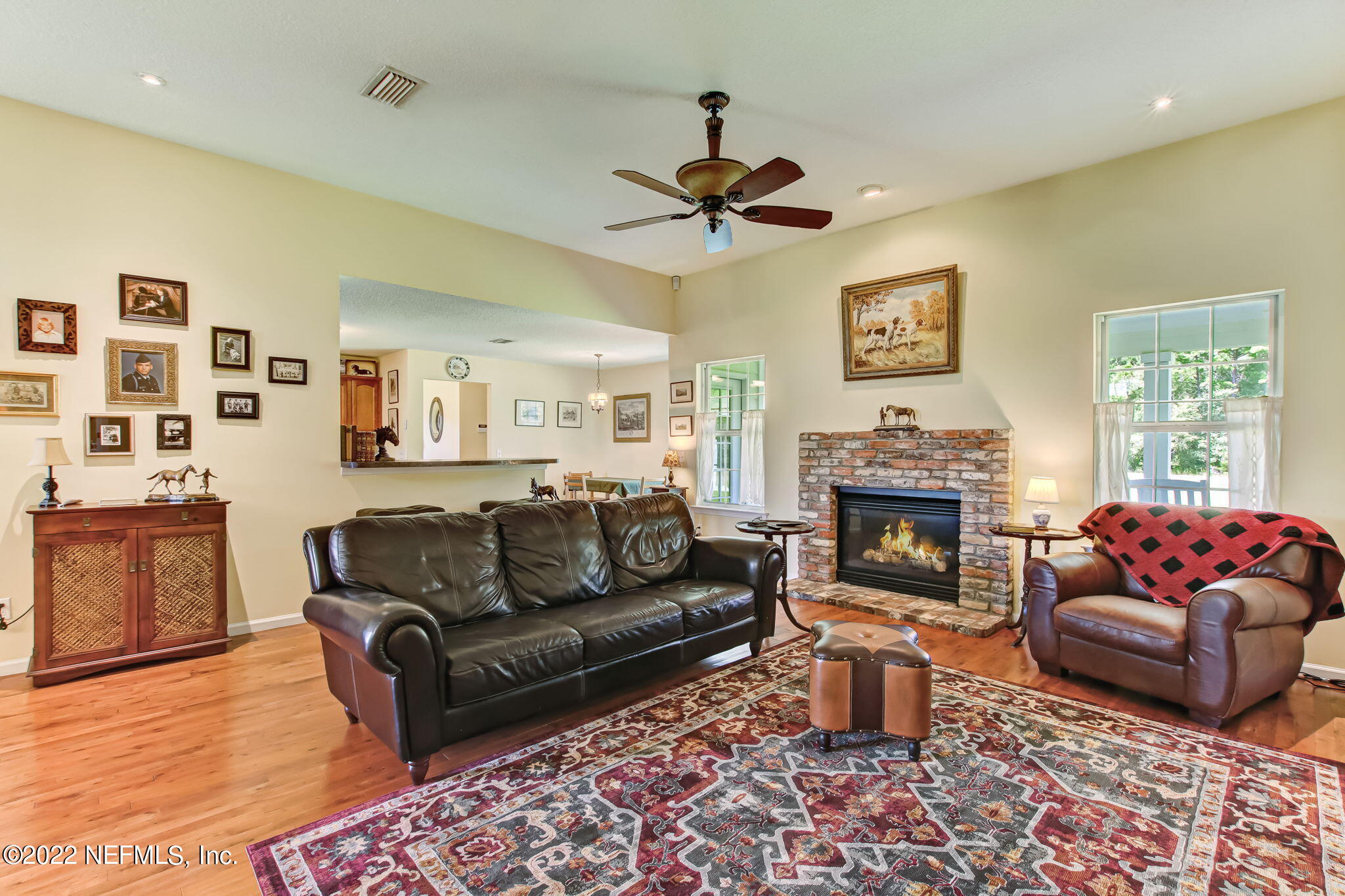 12410 County Road 121 Bryceville, FL 32009 - Photo 6 of 34 a living room with furniture and a fireplace