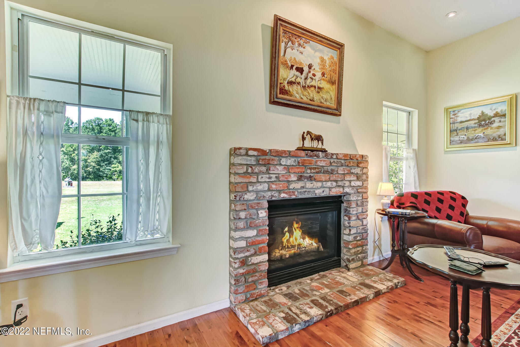 12410 County Road 121 Bryceville, FL 32009 - Photo 7 of 34 a living room with furniture a window and a fireplace