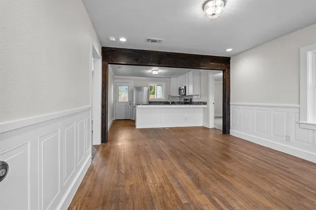 a view of a kitchen with a sink and a stove top oven
