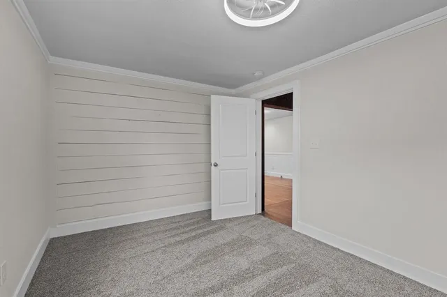 a view of an empty room and a window