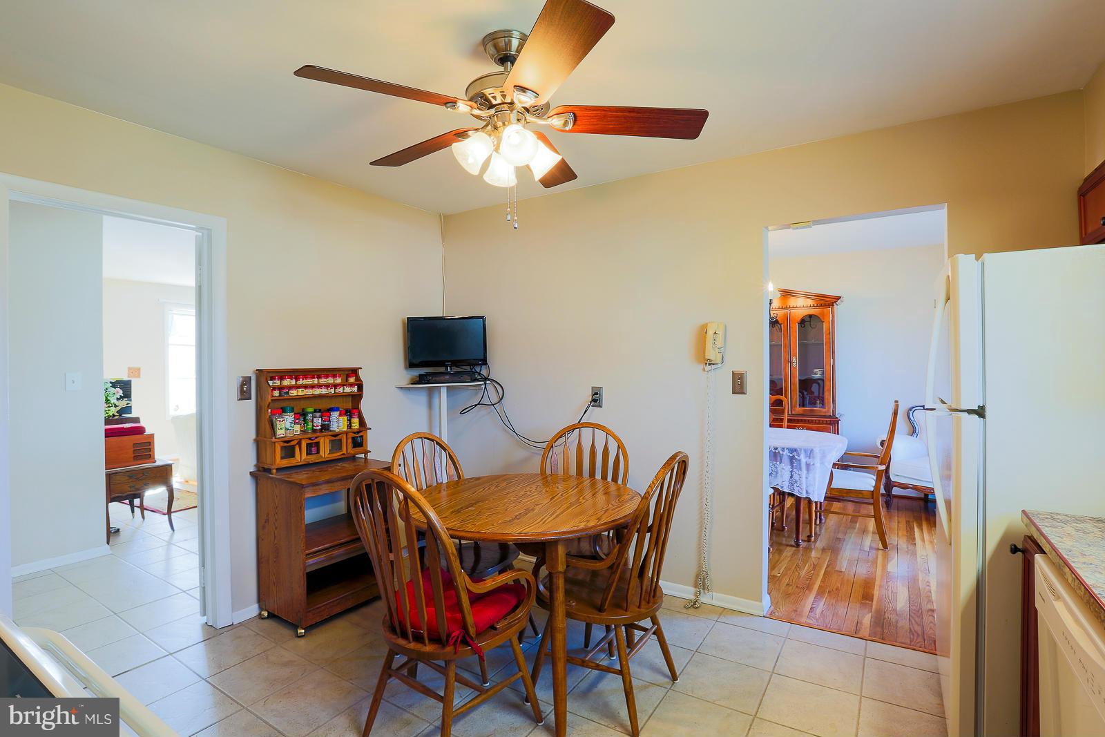 3834 Cherrybrook Road Randallstown, MD 21133 - Photo 11 of 30 a view of a dining room with furniture and wooden floor