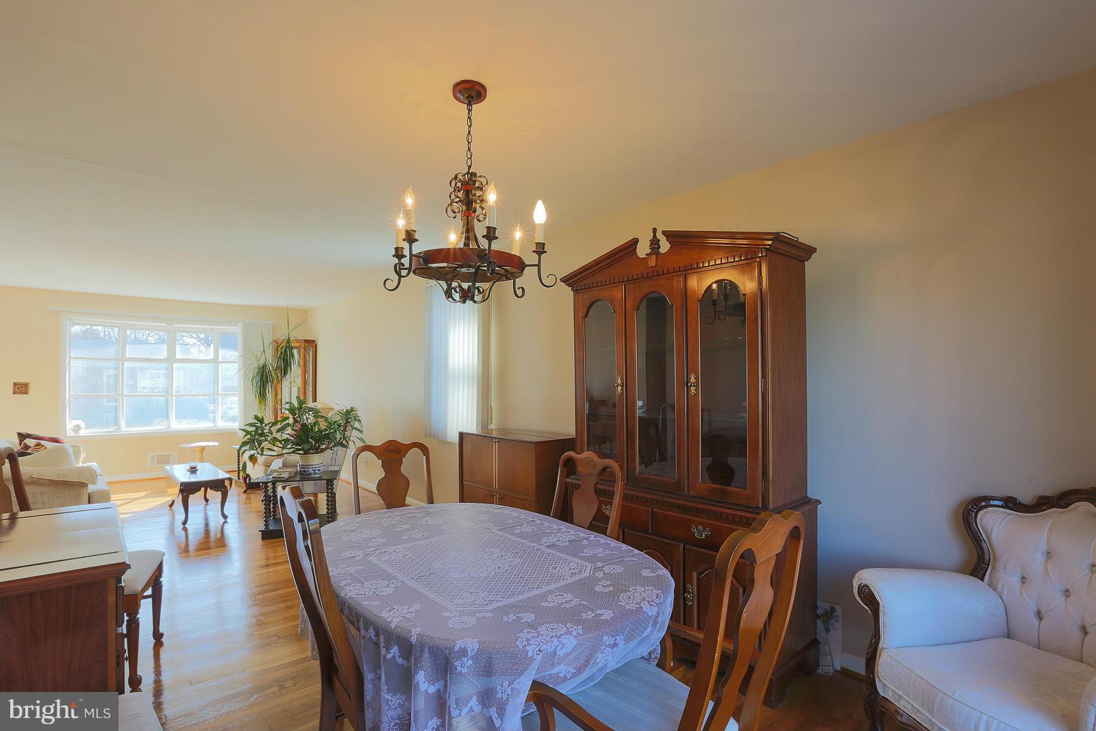 3834 Cherrybrook Road Randallstown, MD 21133 - Photo 15 of 30 a view of a dining room with furniture and wooden floor