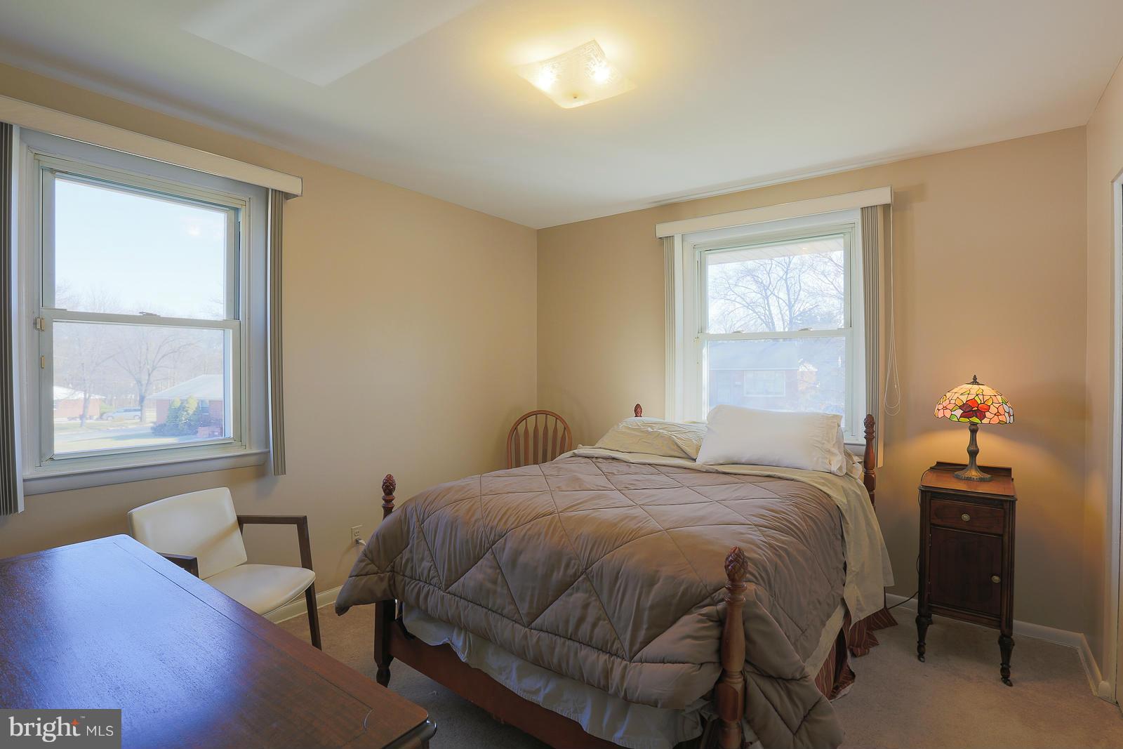 3834 Cherrybrook Road Randallstown, MD 21133 - Photo 17 of 30 a bedroom with a bed and wooden floor