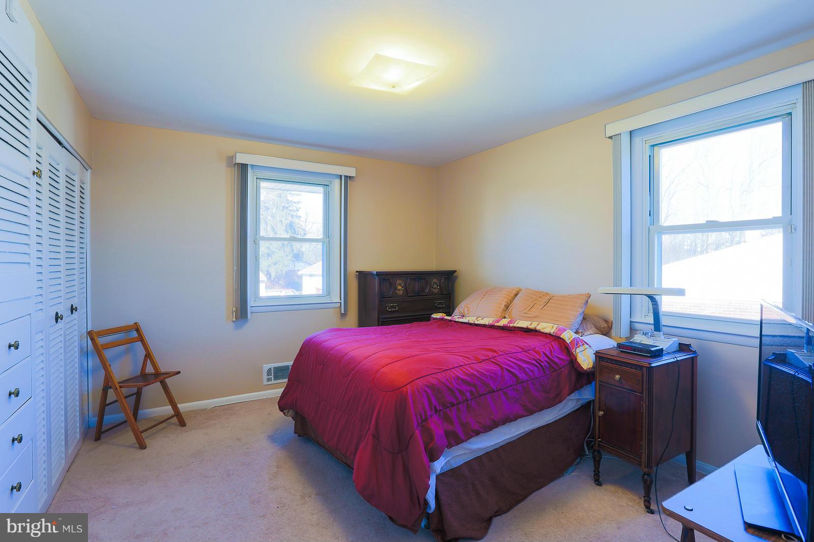 3834 Cherrybrook Road Randallstown, MD 21133 - Photo 18 of 30 a bed sitting in a bedroom next to a window