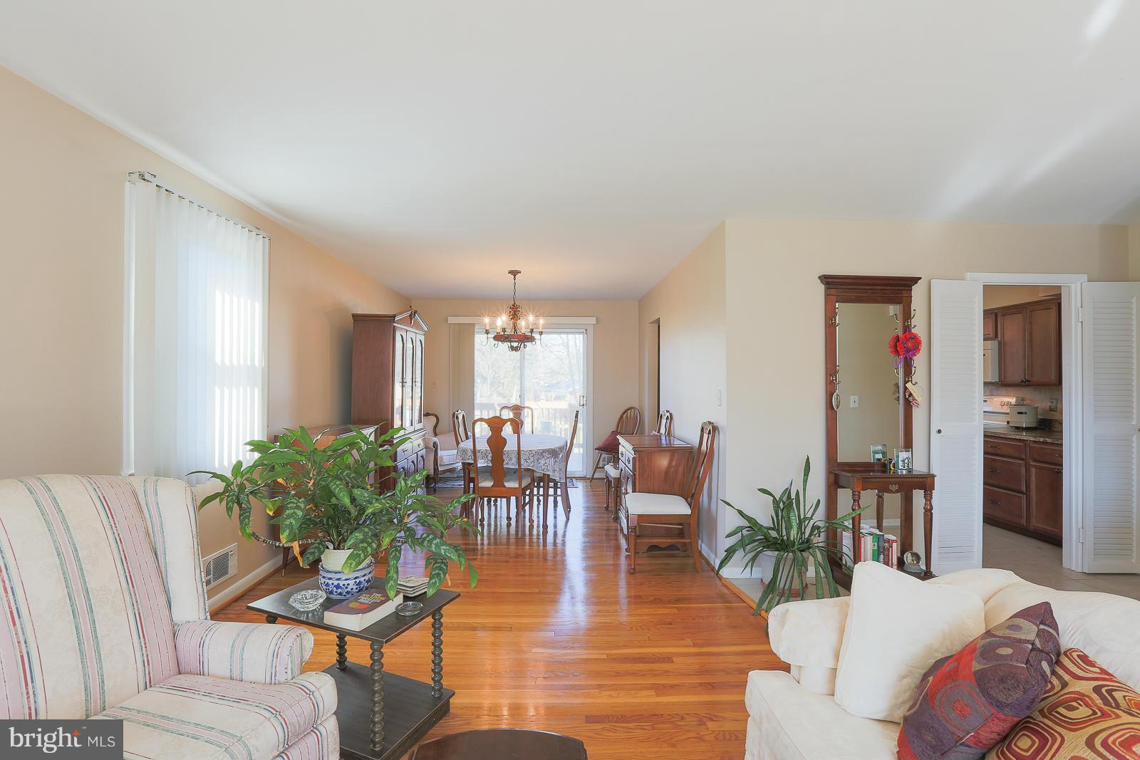3834 Cherrybrook Road Randallstown, MD 21133 - Photo 5 of 30 a living room with furniture and wooden floor