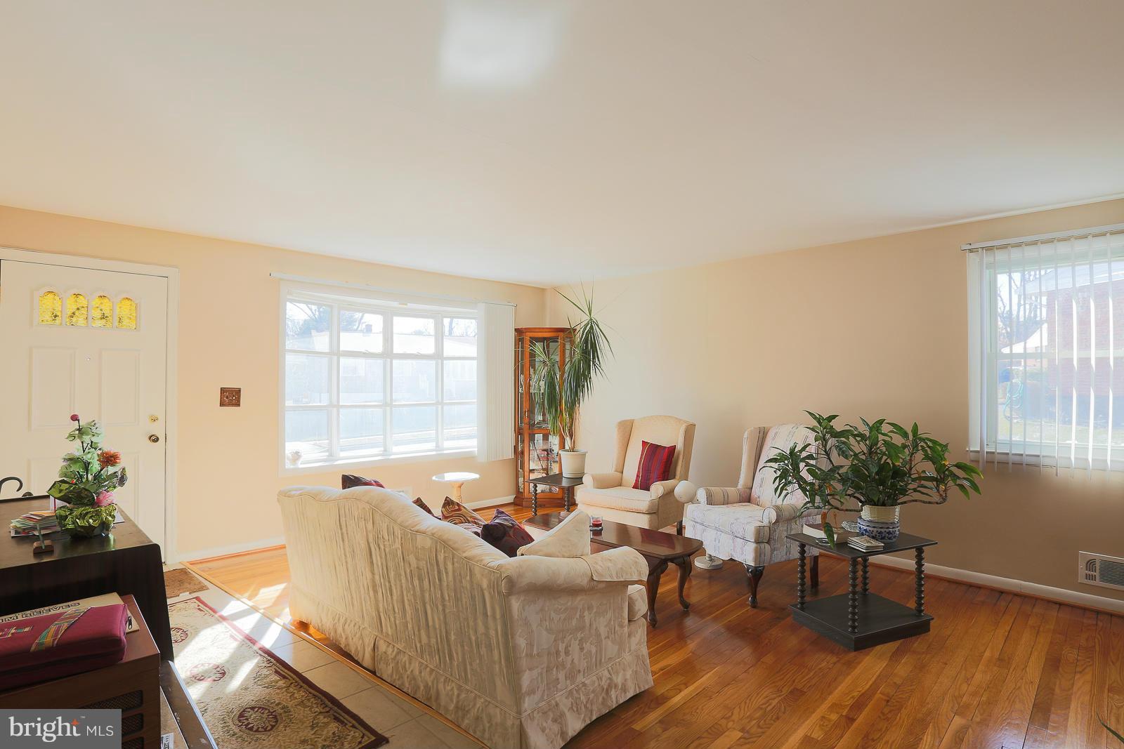 3834 Cherrybrook Road Randallstown, MD 21133 - Photo 7 of 30 a living room with furniture and a potted plant