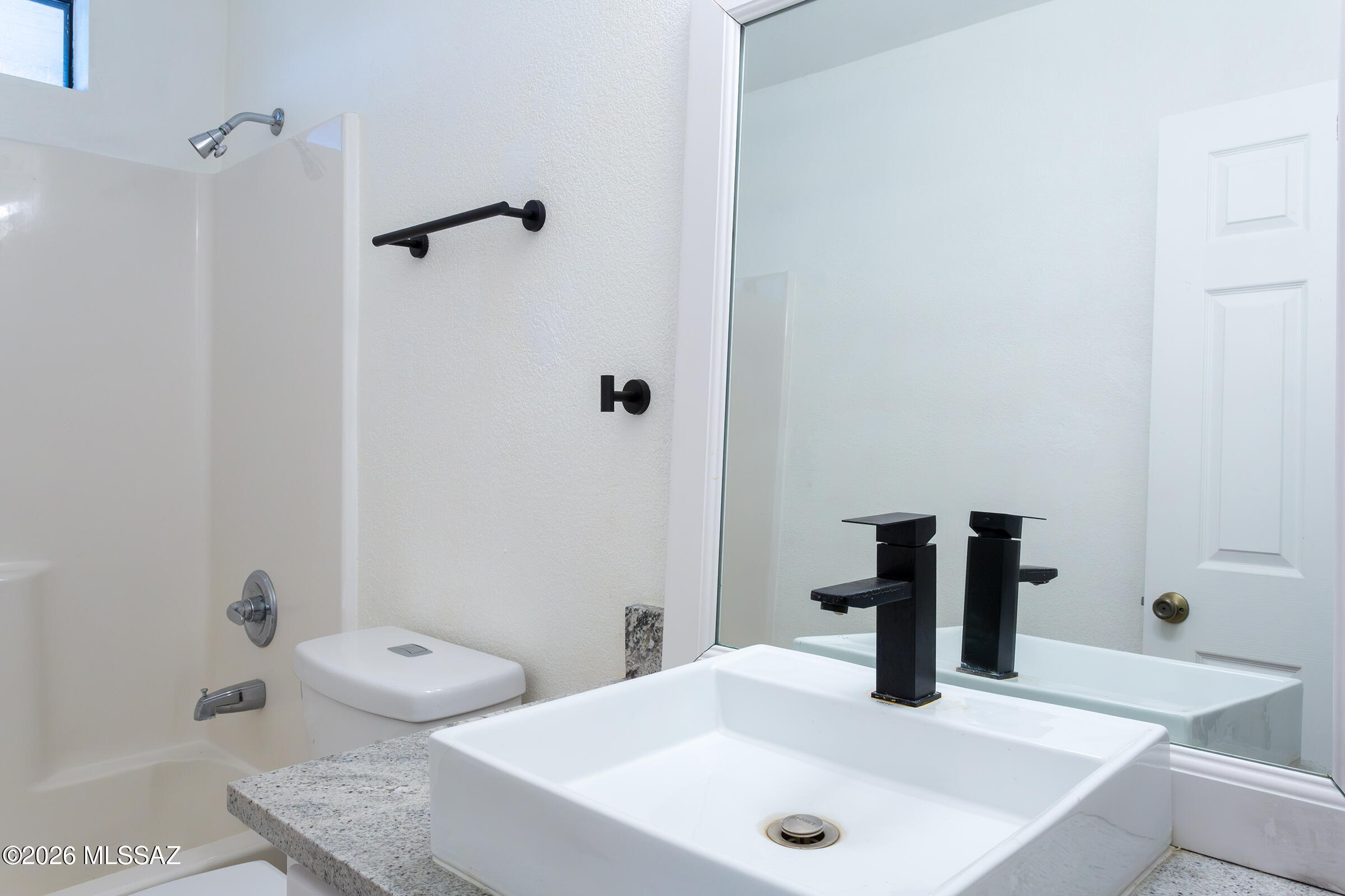 1081 Paseo Freno Rio Rico, AZ 85648 - Photo 14 of 46 a bathroom with a sink and a tub