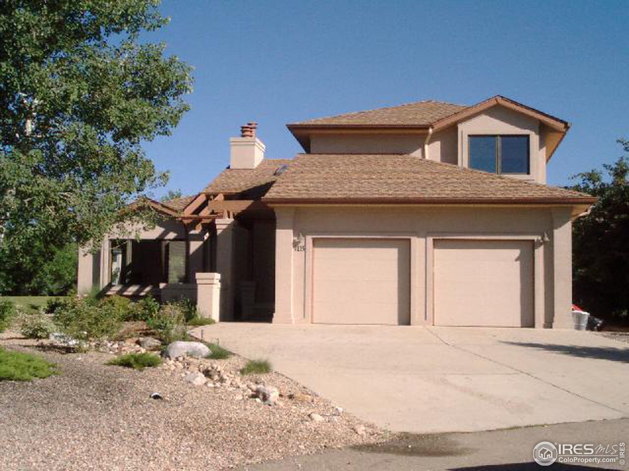 7225 Four Rivers Road Boulder, CO 80301 - Photo 1 of 6 a front view of a house with a yard