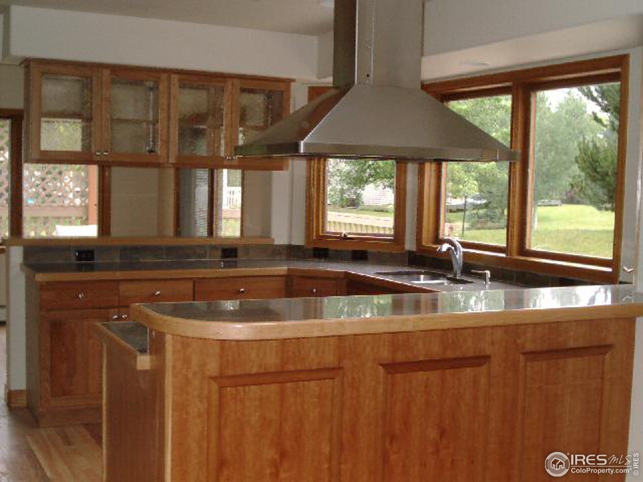 7225 Four Rivers Road Boulder, CO 80301 - Photo 2 of 6 a kitchen with a sink a counter top space and a large window