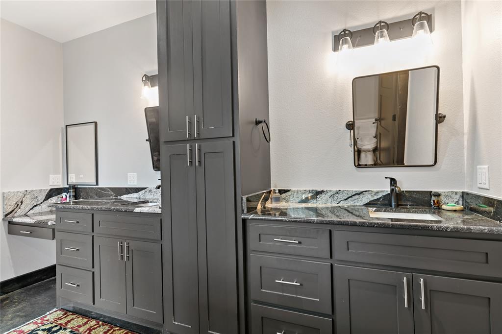 8127 Fm 910 Bogata, TX 75417 - Photo 11 of 22 a bathroom with a granite countertop double vanity sink and mirror