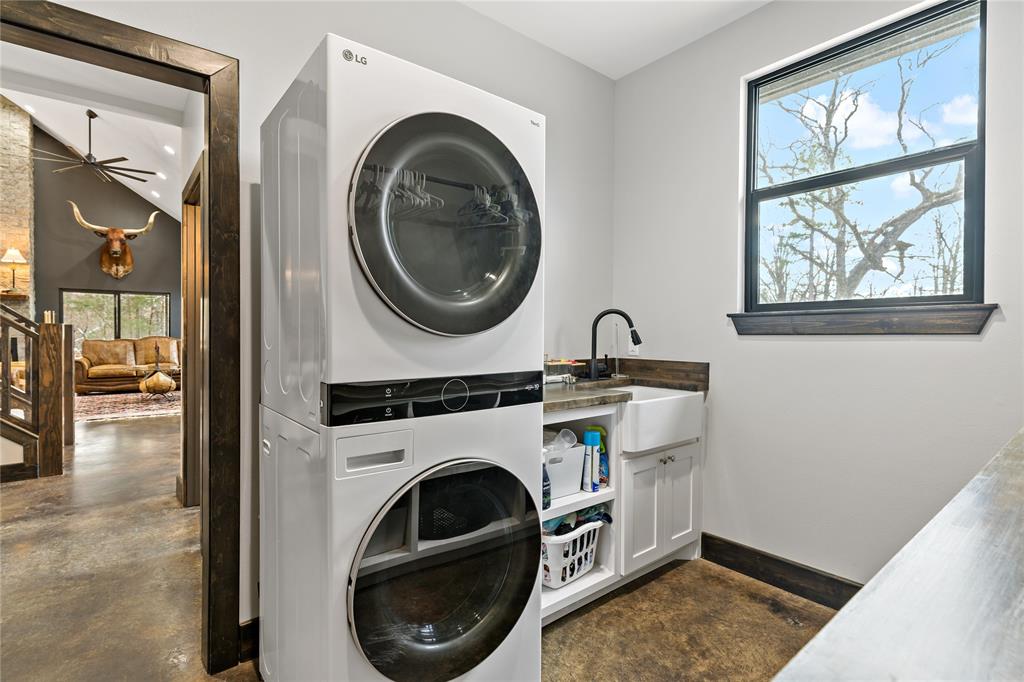8127 Fm 910 Bogata, TX 75417 - Photo 13 of 22 a utility room with dryer and washer