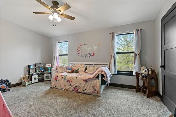 a bed room with furniture and a window
